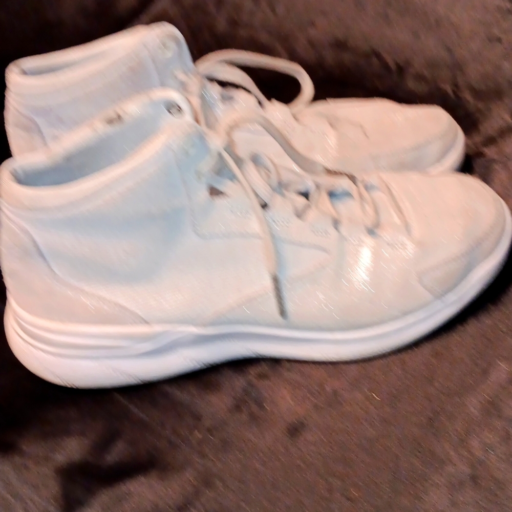 Under Armor, woman's sparly high top sneaker.